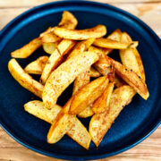 Plate of vegan Japanese togarashi fries seasoned with shichimi togarashi Japanese spice