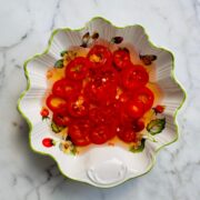 Sliced red chilis pickling in vinegar