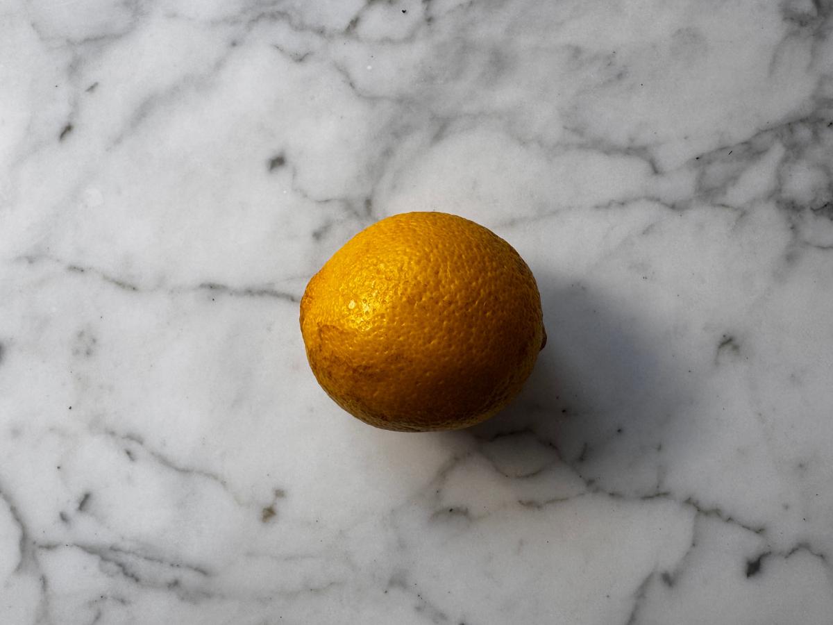a lemon on a marble worktop