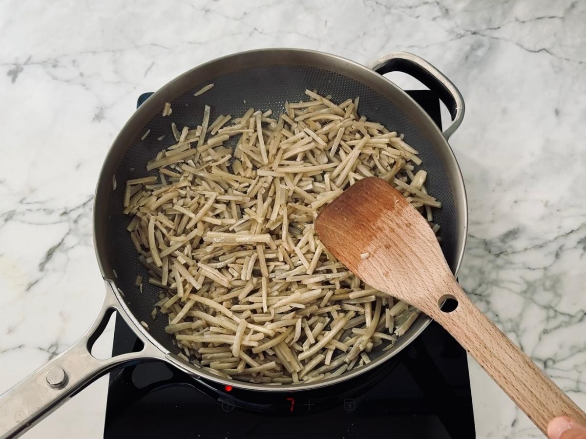 Shredded burdock root stir-fried in sesame oil until tender for easy Kinpira Gobo side dish