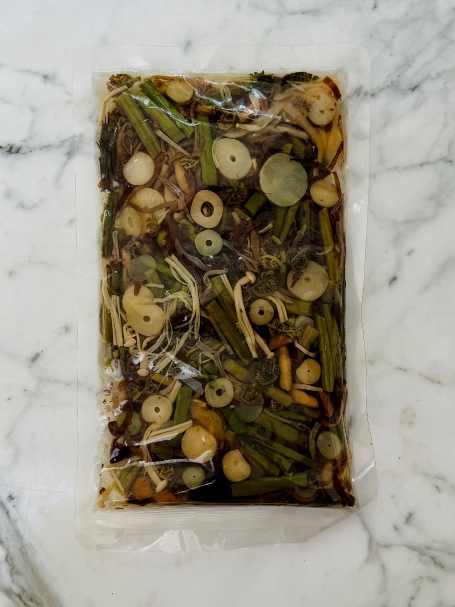 a sealed bag of mountain vegetables in water