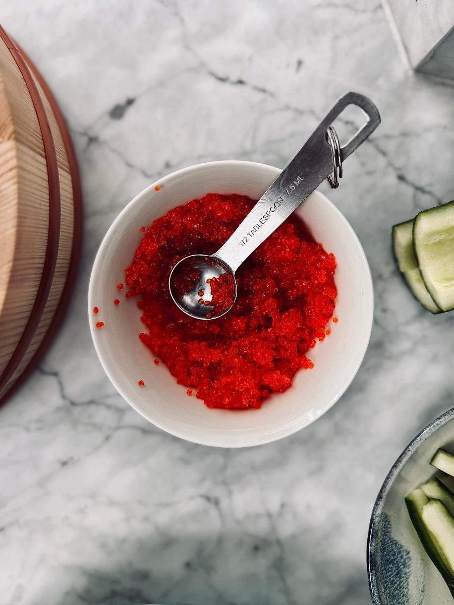 a bowl of orange vegan caviar