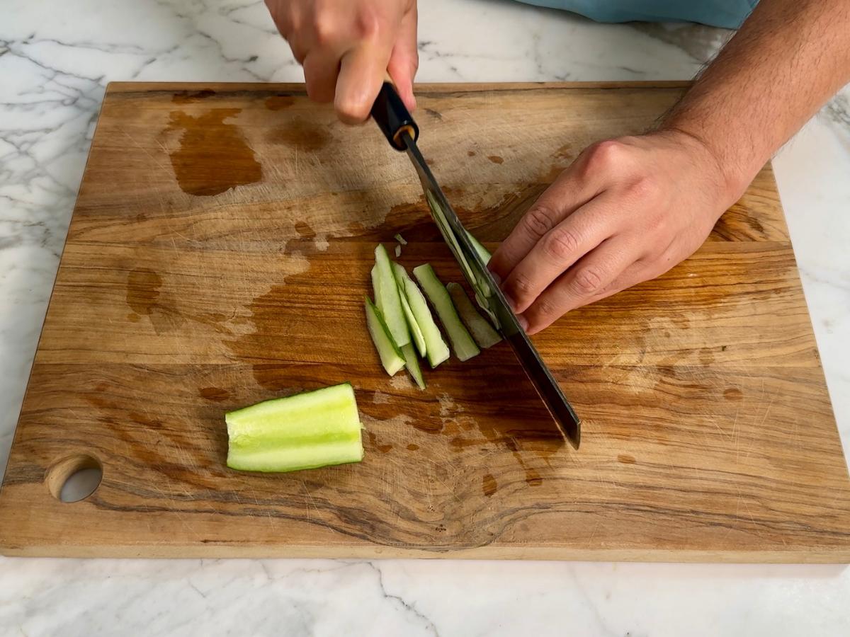 Cucumber julienned into thin sticks after deseeding.