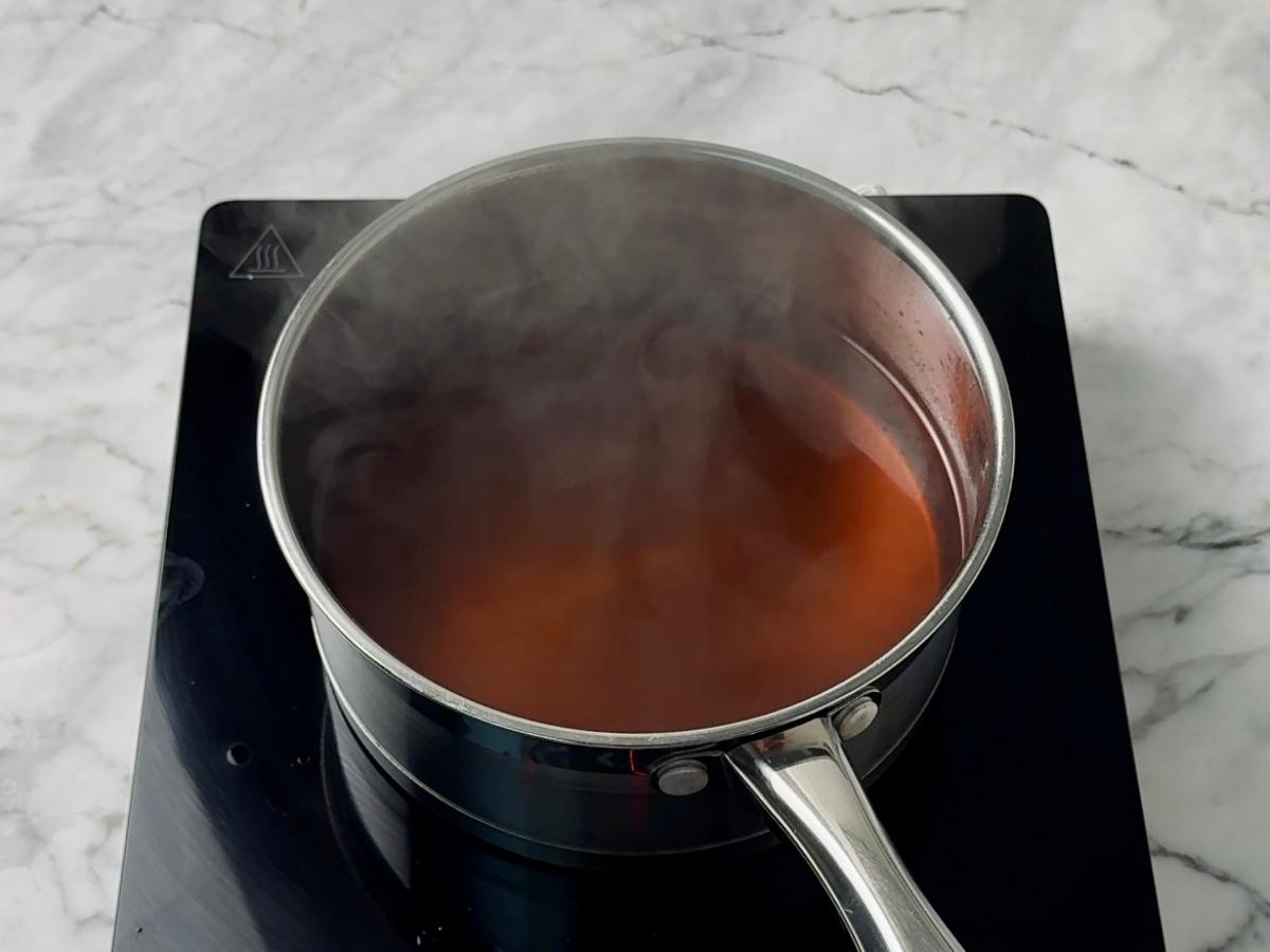broth steaming in a small saucepan