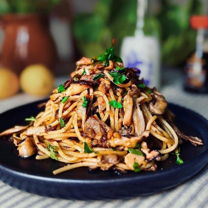 miso mushroom pasta topped with parsley and chili oil
