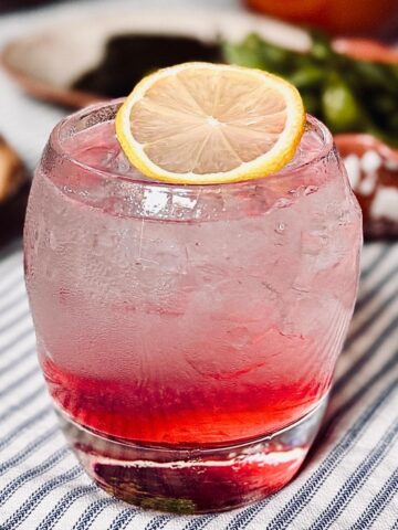 sake fizz on a striped cotton table cloth
