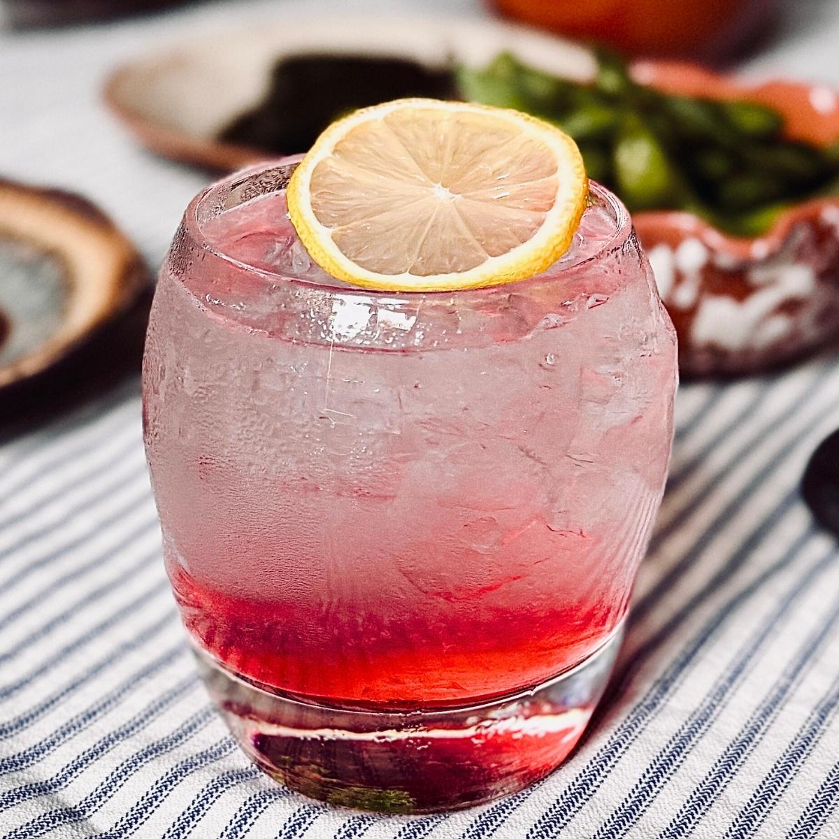 sake fizz on a striped cotton table cloth
