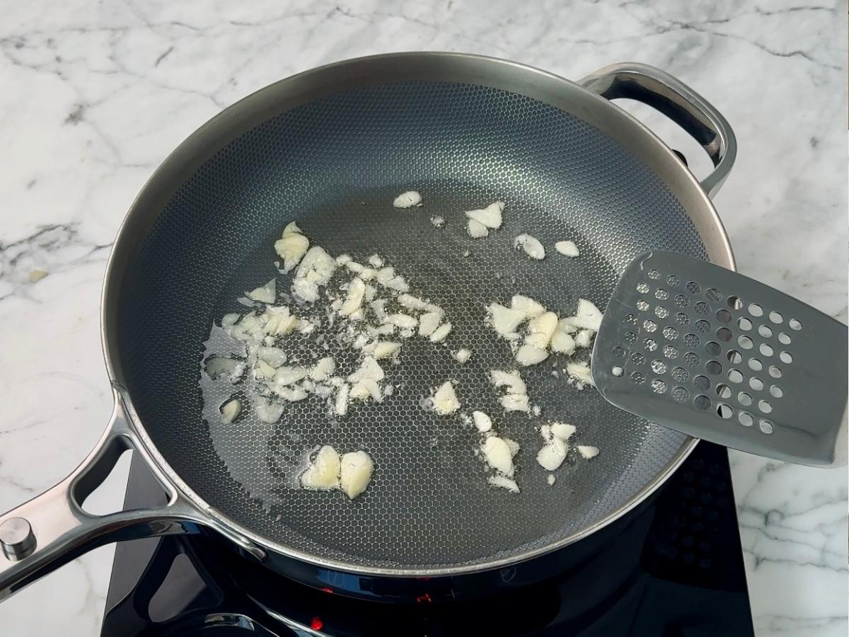 garlic frying in a pan