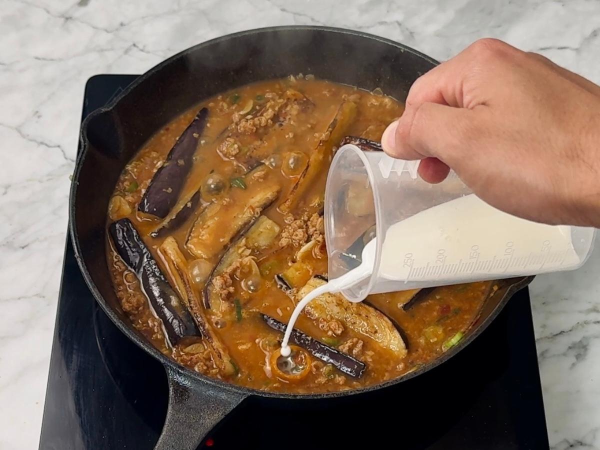 cornstarch mixture being added to the skillet