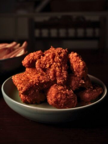 vegan fried chicken piled high on a small plate