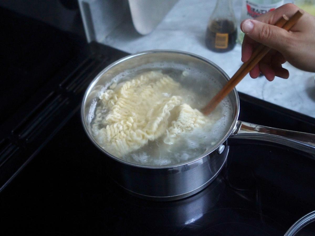 noodles being cooking in boiling water