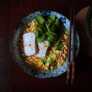 Vegan miso ramen in a bowl with toppings and chopsticks resting on the rim