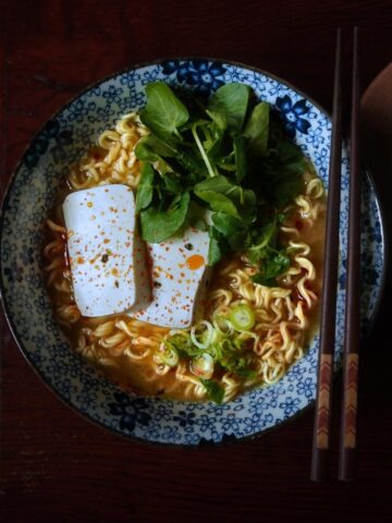 top down view of miso ramen with toppings. Wooden chopsticks resting on the lip of the bowl