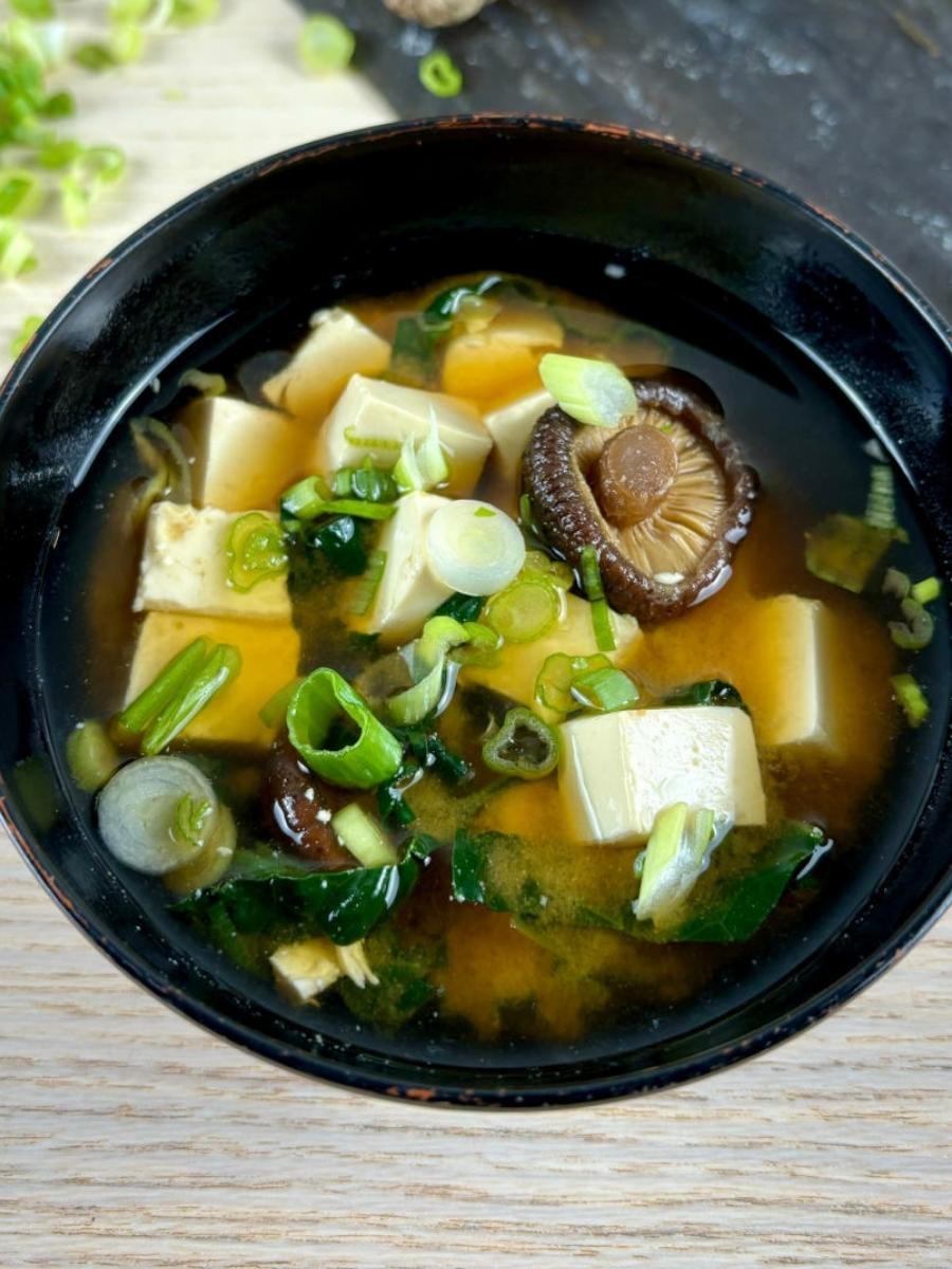 close up of miso soup in a bowl