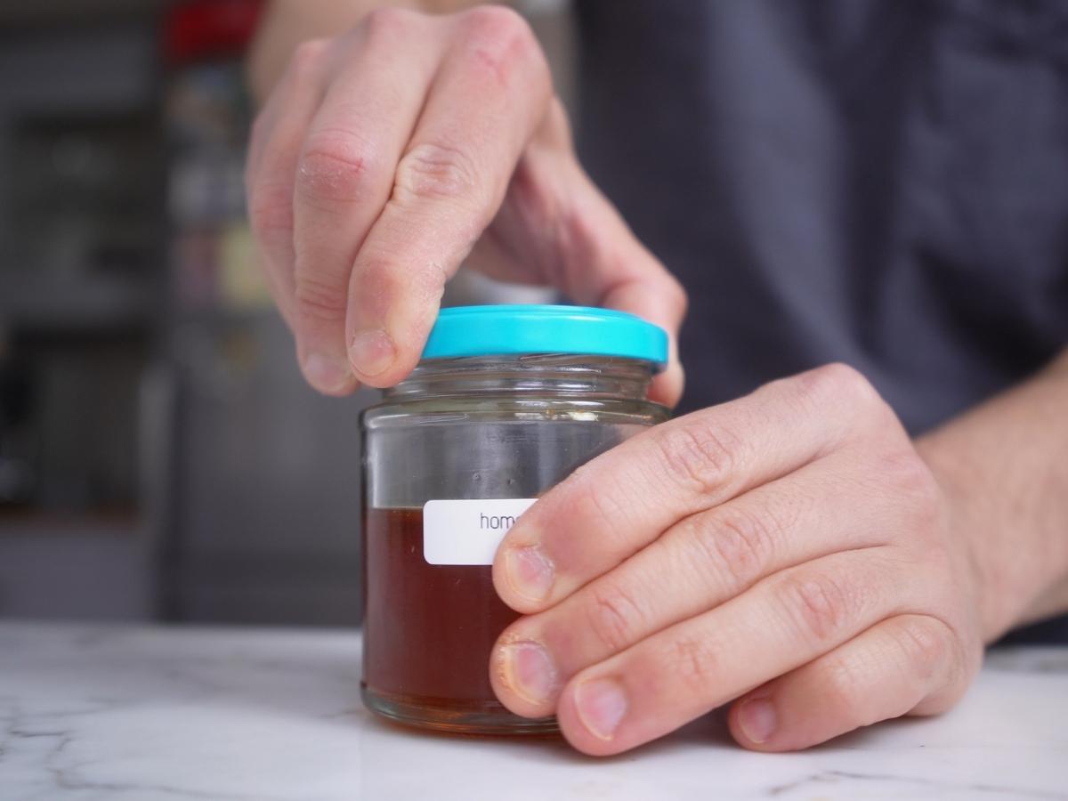 sealing jar of homemade rayu chili oil
